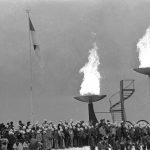 
              FILE - The Olympic flame of 1976, right and the old one of 1964 Winter Olympics burn in their trays after being ignited in the opening ceremonies for the 12th Olympic Winter Games, on Feb. 4, 1976, Innsbruck, Austria. (AP Photo, File)
            