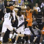 
              Oklahoma State forward Tyreek Smith, right, pressures Baylor guard Matthew Mayer on his attempted basket in the first half of an NCAA college basketball game, Saturday, Jan. 15, 2022, in Waco, Texas. (Rod Aydelotte/Waco Tribune Herald, via AP)
            