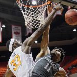 
              Oklahoma State forward Moussa Cisse (33) blocks a shot by Iowa State guard Tyrese Hunter (11) in the first half of an NCAA college basketball game Wednesday, Jan. 26, 2022, in Stillwater, Okla. (AP Photo/Sue Ogrocki)
            