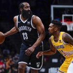 
              Los Angeles Lakers' Malik Monk (11) defends Brooklyn Nets' James Harden (13) during the second half of an NBA basketball game Tuesday, Jan. 25, 2022 in New York. The Lakers won 106-96. (AP Photo/Frank Franklin II)
            