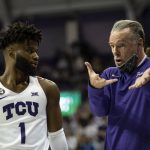 
              TCU head coach Jamie Dixon, right, talks to guard Mike Miles (1) in the first half of an NCAA college basketball game against Baylor in Fort Worth, Texas, Saturday, Jan. 8, 2022. (AP Photo/Emil Lippe)
            