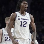 
              Kansas State forward Carlton Linguard Jr. (12) celebrates after a basket during the first half of an NCAA college basketball game against Texas Tuesday, Jan. 4, 2022, in Manhattan, Kan. (AP Photo/Charlie Riedel)
            