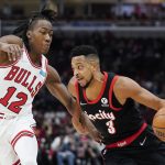 
              Portland Trail Blazers guard CJ McCollum, right, drives against Chicago Bulls guard Ayo Dosunmu during the first half of an NBA basketball game in Chicago, Sunday, Jan. 30, 2022. (AP Photo/Nam Y. Huh)
            
