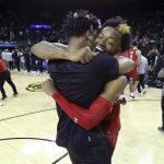 
              Texas Tech guard Adonis Arms celebrates with a teammate after they defeated No. 1 Baylor in an NCAA college basketball game Tuesday, Jan. 11, 2022, in Waco, Texas. (AP Photo/Jerry Larson)
            