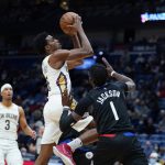 
              New Orleans Pelicans forward Herbert Jones drives to the basket against Los Angeles Clippers guard Reggie Jackson (1) in the first half of an NBA basketball game in New Orleans, Thursday, Jan. 13, 2022. (AP Photo/Gerald Herbert)
            