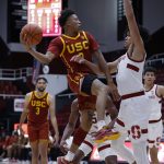 
              Southern California guard Boogie Ellis (0), left, drives for the basket as Stanford forward Spencer Jones (14), right, defends during the first half of an NCAA college basketball game Tuesday, Jan. 11, 2022, in Stanford, Calif. (AP Photo/Josie Lepe)
            