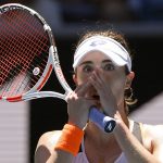 
              Alize Cornet of France reacts after defeating Tamara Zidansek of Slovenia in their third round match at the Australian Open tennis championships in Melbourne, Australia, Saturday, Jan. 22, 2022. (AP Photo/Andy Brownbill)
            