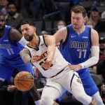 
              Denver Nuggets guard Austin Rivers (25) passes off against Dallas Mavericks guard Luka Doncic (77) during the first half of an NBA basketball game in Dallas, Monday, Jan. 3, 2022. (AP Photo/LM Otero)
            