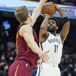 
              Brooklyn Nets' Kyrie Irving (11) shoots over Cleveland Cavaliers' Lauri Markkanen, left, in the second half of an NBA basketball game, Monday, Jan. 17, 2022, in Cleveland. (AP Photo/Tony Dejak)
            