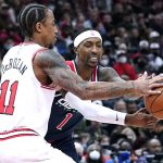 
              Washington Wizards guard Kentavious Caldwell-Pope, right, and Chicago Bulls forward DeMar DeRozan battle for the ball during the first half of an NBA basketball game in Chicago, Friday, Jan. 7, 2022. (AP Photo/Nam Y. Huh)
            