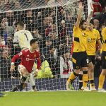 
              Manchester United's Cristiano Ronaldo scores a goal which was disallowed during the English Premier League soccer match between Manchester United and Wolverhampton Wanderers at Old Trafford stadium in Manchester, England, Monday, Jan.3, 2022. (AP Photo/Dave Thompson)
            