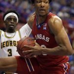 
              Kansas forward David McCormack, right, rebounds against George Mason guard Davonte Gaines (3) during the first half of an NCAA college basketball game in Lawrence, Kan., Saturday, Jan. 1, 2022. (AP Photo/Orlin Wagner)
            