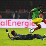 
              Cape Verde's Stopira, left, challenges Ethiopia's Fitsum Alemu during the African Cup of Nations 2022 group A soccer match between Ethiopia and Cape Verde at the Olembe stadium in Yaounde, Cameroon, Sunday, Jan. 9, 2022. (AP Photo/Themba Hadebe)
            