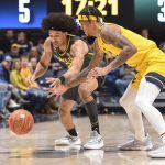 
              West Virginia forward Jalen Bridges (11) steals the ball from Baylor guard Kendall Brown (2) during the first half of an NCAA college basketball game in Morgantown, W.Va., Tuesday, Jan. 18, 2022. (William Wotring)
            