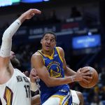 
              Golden State Warriors guard Jordan Poole (3) goes to the basket against New Orleans Pelicans center Jonas Valanciunas (17) in the first half of an NBA basketball game in New Orleans, Thursday, Jan. 6, 2022. (AP Photo/Gerald Herbert)
            