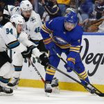 
              Buffalo Sabres defenseman Will Butcher (4) is pressured by San Jose Sharks left wing Alexander Barabanov (94) and center Tomas Hertl (48) during the second period of an NHL hockey game, Thursday, Jan. 6, 2022, in Buffalo, N.Y. (AP Photo/Jeffrey T. Barnes)
            