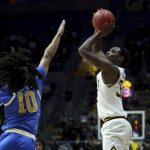 
              California guard Jalen Celestine (32) shoots against UCLA guard Tyger Campbell (10) during the first half of an NCAA college basketball game in Berkeley, Calif., Saturday, Jan. 8, 2022. (AP Photo/Jed Jacobsohn)
            