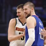 
              Denver Nuggets center Nikola Jokic, left, and Los Angeles Clippers center Ivica Zubac hug each other prior an NBA basketball game Tuesday, Jan. 11, 2022, in Los Angeles. (AP Photo/Mark J. Terrill)
            