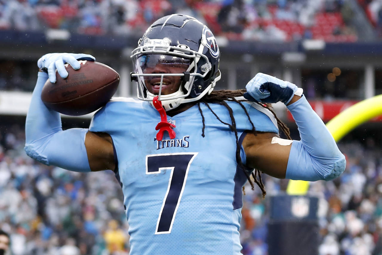Tennessee Titans running back D'Onta Foreman celebrates after scoring a touchdown on a 21-yard run ...