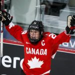 
              FILE - Canada's Marie-Philip Poulin celebrates her overtime goal against the United States during the IIHF hockey women's world championships title game in Calgary, Alberta, Tuesday, Aug. 31, 2021. The United States is the defending Olympic champion after beating Canada in an exceptionally nail-biting 3-2 shootout win at South Korea in 2018 to end Canada's run of four gold medals. And yet, Canada is the reigning world champion after punching back with a 3-2 overtime gold-medal win in Calgary, Alberta, in August to end USA's run of five consecutive titles.(Jeff McIntosh/The Canadian Press via AP, File)
            