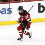 
              New Jersey Devils center Jack Hughes (86) reacts after scoring a goal against the Carolina Hurricanes during the third period of an NHL hockey game, Saturday, Jan. 22, 2022, in Newark, N.J. (AP Photo/Noah K. Murray)
            