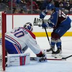 
              Colorado Avalanche center Alex Newhook (18) takes a shot on goal against Montreal Canadiens goaltender Cayden Prime (30) during the second period of an NHL hockey game Saturday, Jan. 22, 2022, in Denver. (AP Photo/Jack Dempsey)
            