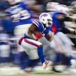
              Buffalo Bills running back Devin Singletary (26) rushes during the second half of an NFL football game against the Atlanta Falcons Sunday, Jan. 2, 2022, in Orchard Park, N.Y. The Bills won 29-15. (AP Photo/Joshua Bessex)
            
