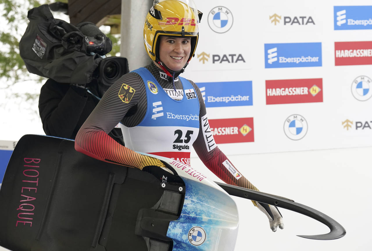 Natalie Geisenberger of Germany smiles after her second run of the Luge World Cup women race in Sig...