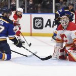 
              Calgary Flames goaltender Jacob Markstrom (25) blocks a shot from St. Louis Blues left wing David Perron (57) during the second period of an NHL hockey game Thursday, Jan. 27, 2022, in St. Louis. (AP Photo/Joe Puetz)
            