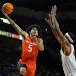 
              Illinois Fighting guard Andre Curbelo (5) goes up for a shot against Maryland guard Marcus Dockery during the first half of an NCAA college basketball game, Friday, Jan. 21, 2022, in College Park, Md. (AP Photo/Julio Cortez)
            