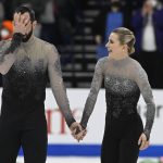 
              Ashley Cain-Gribble and Timothy LeDuc compete in the pairs free skate program during the U.S. Figure Skating Championships Saturday, Jan. 8, 2022, in Nashville, Tenn. (AP Photo/Mark Zaleski)
            