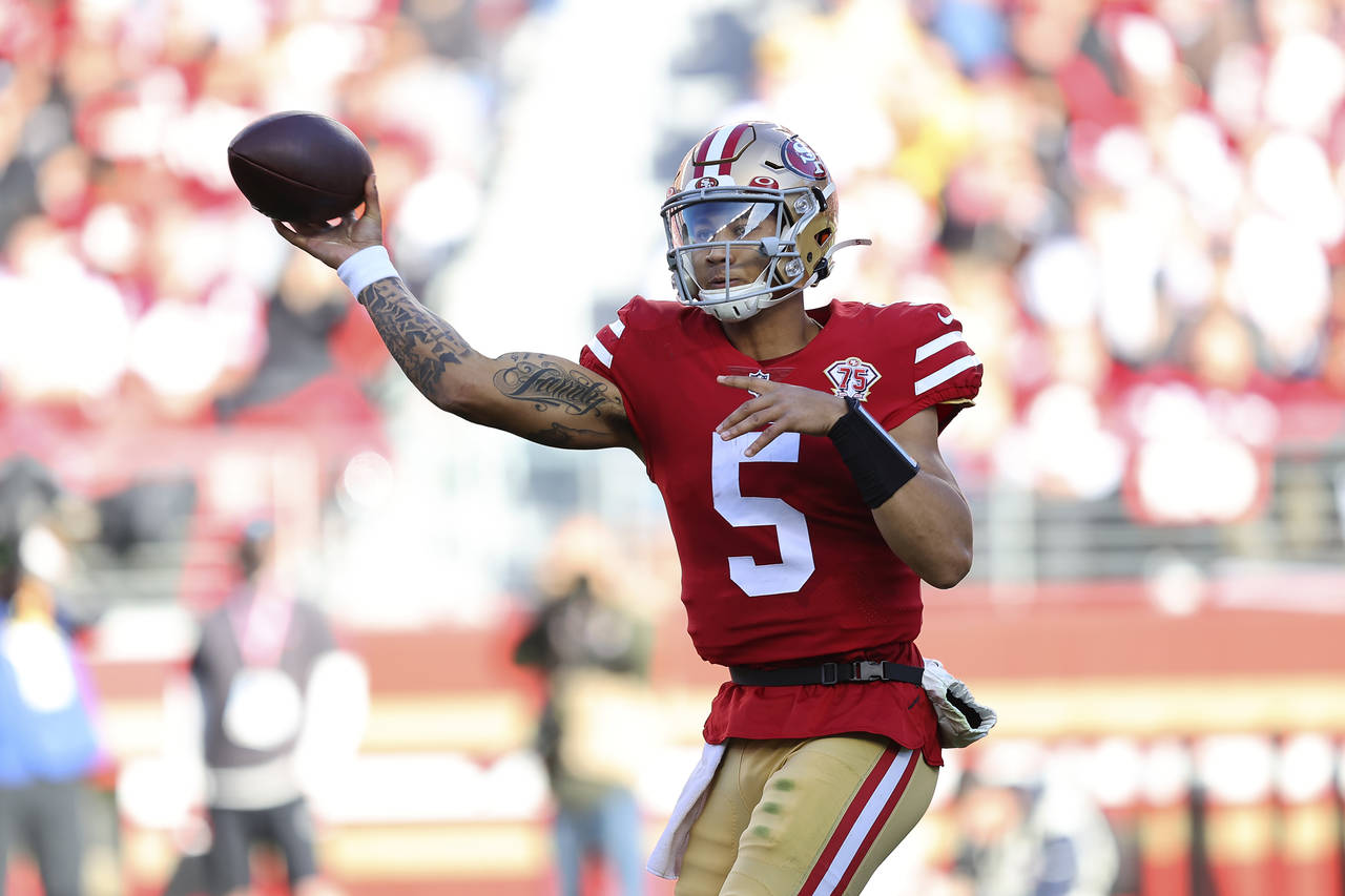 San Francisco 49ers quarterback Trey Lance (5) passes against the Houston Texans during the first h...