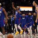 
              Los Angeles Clippers guard Terance Mann (14) celebrates a come from behind victory against the Washington Wizards, Tuesday, Jan. 25, 2022, in Washington. The Clippers erased a 35 point deficit to defeat the Wizards 116-115. (AP Photo/Evan Vucci)
            