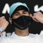 
              Spain's Rafael Nadal removes his mask for a press conference ahead of the Australian Open tennis championships in Melbourne, Australia, Saturday, Jan. 15, 2022. (AP Photo/Simon Baker)
            