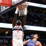
              Washington Wizards center Montrezl Harrell (6) dunks over Oklahoma City Thunder center Mike Muscala, right, during the first half of an NBA basketball game, Tuesday, Jan. 11, 2022, in Washington. (AP Photo/Nick Wass)
            