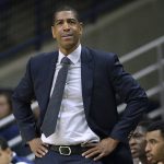 
              FILE - In this Feb. 7, 2018, file photo, Connecticut head coach Kevin Ollie watches from the sideline during the first half an NCAA college basketball game in Storrs, Conn. An independent arbiter has ruled that UConn improperly fired former men's basketball coach Kevin Ollie and must pay him more than $11 million, Ollie's lawyer said Thursday, Jan. 20, 2022. (AP Photo/Jessica Hill, File)
            