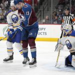 
              Colorado Avalanche right wing Valeri Nichushkin, second from left, tries to redirect the puck at Buffalo Sabres goaltender Dustin Tokarski, right, while jostling for position with Sabres defenseman Mark Pysyk in the first period of an NHL hockey game Sunday, Jan. 30, 2022, in Denver. (AP Photo/David Zalubowski)
            