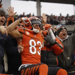 
              Cincinnati Bengals wide receiver Tyler Boyd (83) celebrates a 5-yard touchdown with fans during the second half of an NFL football game against the Kansas City Chiefs, Sunday, Jan. 2, 2022, in Cincinnati. (AP Photo/Jeff Dean)
            