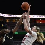 
              Louisville forward Emily Engstler (21) shoots over Wake Forest forward Demeara Hinds (25) during the second half of an NCAA college basketball game in Louisville, Ky., Sunday, Jan. 23, 2022. Louisville won 72-60. (AP Photo/Timothy D. Easley)
            