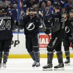 
              Tampa Bay Lightning left wing Alex Killorn (17) celebrates his goal against the Dallas Stars with teammates, including defenseman Zach Bogosian (24) and defenseman Victor Hedman (77) during the third period of an NHL hockey game Saturday, Jan. 15, 2022, in Tampa, Fla. (AP Photo/Chris O'Meara)
            