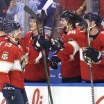 
              Florida Panthers center Sam Reinhart (13) is congratulated after scoring a goal during the first period of an NHL hockey game against the Vancouver Canucks, Tuesday, Jan. 11, 2022, in Sunrise, Fla. (AP Photo/Lynne Sladky)
            