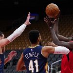
              Toronto Raptors forward Pascal Siakam (43) makes an outlet pass while under pressure from New Orleans Pelicans center Jonas Valanciunas (17) and forward Garrett Temple (41) during second-half NBA basketball game action in Toronto, Sunday, Jan. 9, 2022. (Frank Gunn/The Canadian Press via AP)
            