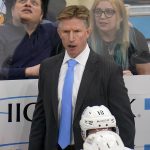 Seattle Kraken head coach Dave Hakstol stands behind his bench during the third period of an NHL hockey game against the Pittsburgh Penguins in Pittsburgh, Thursday, Jan. 27, 2022. The Kraken won in overtime 2-1. (AP Photo/Gene J. Puskar)