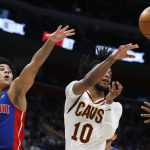 
              Cleveland Cavaliers guard Darius Garland (10) passes the ball against Detroit Pistons guard Killian Hayes (7) during the second half of an NBA basketball game Sunday, Jan. 30, 2022, in Detroit. (AP Photo/Duane Burleson)
            
