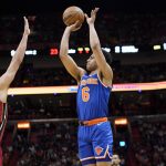 
              New York Knicks guard Quentin Grimes (6) shoots over Miami Heat guard Max Strus (31) during the first half of an NBA basketball game, Wednesday, Jan. 26, 2022, in Miami. (AP Photo/Lynne Sladky)
            