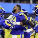 
              Los Angeles Rams defensive end Aaron Donald, middle, celebrates with teammates during the second half of the NFC Championship NFL football game against the San Francisco 49ers Sunday, Jan. 30, 2022, in Inglewood, Calif. (AP Photo/Jed Jacobsohn)
            