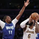 
              Los Angeles Lakers forward LeBron James (6) drives to basket against Minnesota Timberwolves center Naz Reid (11) during the first half of an NBA basketball game in Los Angeles, Sunday, Jan. 2, 2022. (AP Photo/Ringo H.W. Chiu)
            