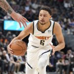 
              Denver Nuggets guard Bryn Forbes drives during the first half of the team's NBA basketball game against the Memphis Grizzlies on Friday, Jan. 21, 2022, in Denver. (AP Photo/David Zalubowski)
            