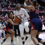 
              Arizona forward Sam Thomas, left, fights for the ball against Stanford forward Francesca Belibi (5) during the first half of an NCAA college basketball game Sunday, Jan. 30, 2022, in Stanford, Calif. (AP Photo/Josie Lepe)
            