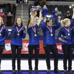 
              From left, Team Peterson's coach Laine Peters, alternate Aileen Geving, Tara Peterson, Becca Hamilton, Nina Roth and Tabitha Peterson wave to fans during the medal presentation following their victory over Team Christensen during the second night of finals at the U.S. Olympic Curling Team Trials at Baxter Arena in Omaha, Neb., Saturday, Nov. 20, 2021. Team Peterson won the match and will represent Team USA at the 2022 Beijing Winter Olympics. (AP Photo/Rebecca S. Gratz)
            
